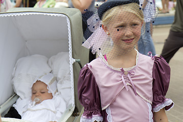 Image showing A girl and a baby