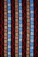 Image showing Red, brown and blue knitted textured as background 