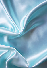 Image showing Smooth elegant blue silk as background 