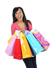 Image showing Excited young black woman with shopping bags