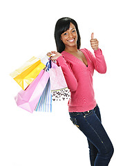 Image showing Young happy black woman with shopping bags