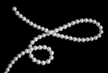 Image showing White pearls on the black velvet 