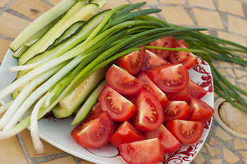 Image showing Raw tomatoes, onion and cucumber