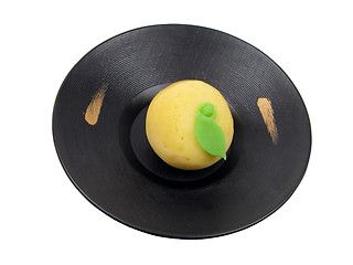 Image showing Lemon shape cake on a wooden plate-clipping path