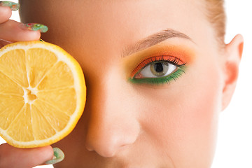 Image showing woman holding lemon