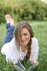 Image showing Smiling girl on the grass