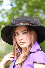 Image showing Girl in violet and black