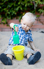 Image showing toddler playing in sandbox