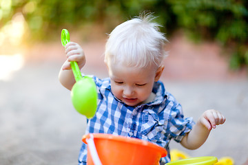 Image showing toddler playing in sand