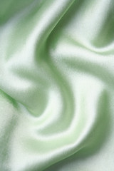 Image showing Smooth elegant green silk as background