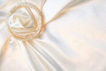 Image showing Smooth elegant white silk with pearls as wedding background