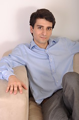 Image showing Man sitting on the couch