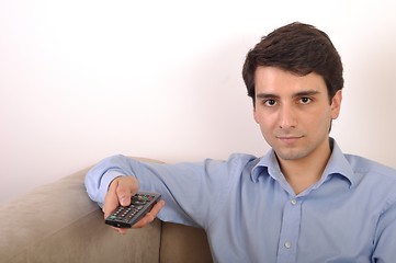 Image showing Smiling man watching tv