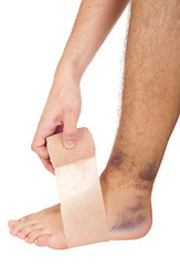 Image showing Bandaging a sprained ankle