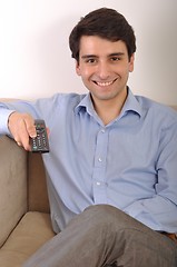 Image showing Smiling man watching tv