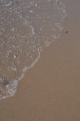 Image showing Foam on sand