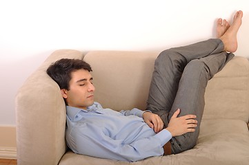 Image showing Man sleeping on the couch