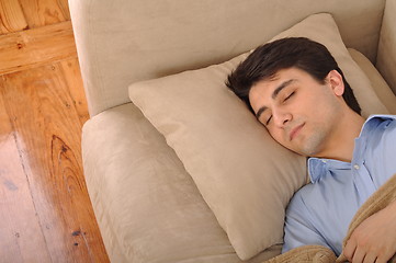 Image showing Man sleeping on the couch