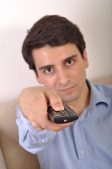 Image showing Smiling man watching tv