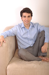 Image showing Man sitting on the couch