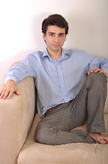 Image showing Man sitting on the couch