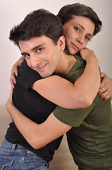 Image showing Brother and sister hugging
