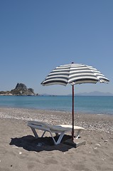 Image showing Beach umbrella and chair