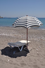 Image showing Beach umbrella and chair