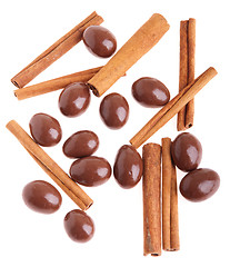 Image showing Chocolate almonds and cinnamon sticks