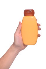 Image showing Hand holding sun lotion