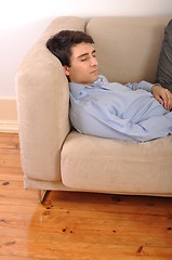 Image showing Man sleeping on the couch