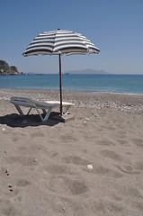 Image showing Beach umbrella and chair