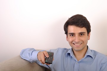 Image showing Smiling man watching tv