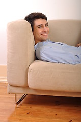 Image showing Man relaxing on the couch