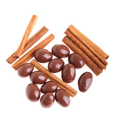 Image showing Chocolate almonds and cinnamon sticks