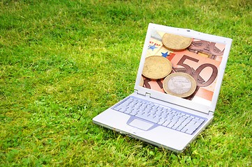 Image showing laptop and money