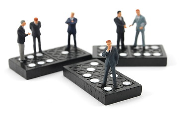 Image showing business man on domino 