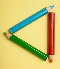 Image showing Color pencils forming a triangle frame