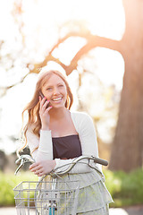 Image showing Beautiful woman talking on the phone outdoor