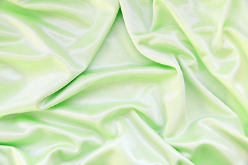 Image showing Smooth elegant green silk as background 