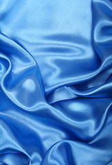 Image showing Smooth elegant blue silk as background 