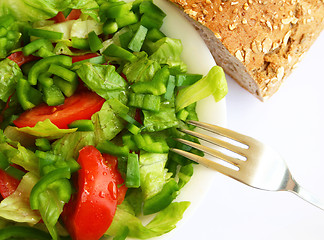 Image showing Healthy vegetarian Salad and bread on the white plate