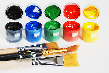 Image showing plastic containers with paint, black, blue, green, red, yellow