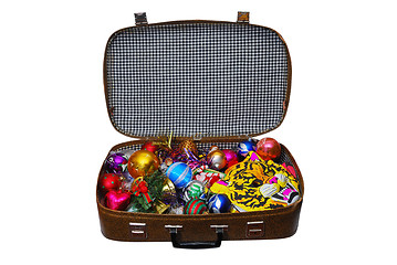 Image showing Christmas-tree decorations in old suitcase