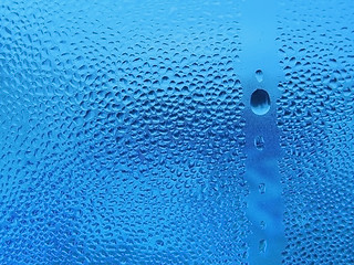 Image showing natural water drops on glass