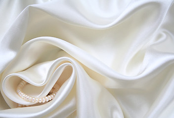 Image showing Smooth elegant white silk with pearls as wedding background