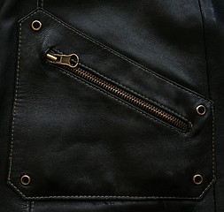 Image showing Pocket with zipper on the black leather texture 