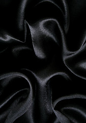 Image showing Smooth elegant black silk as background