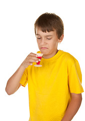 Image showing boy drinking medicine