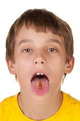 Image showing boy taking a pill
